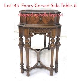 Lot 143 Fancy Carved Side Table. 8 shaped spindle legs wi