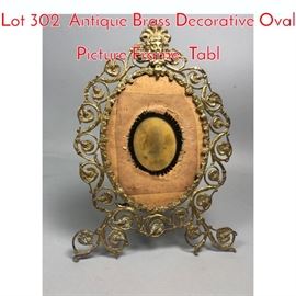 Lot 302 Antique Brass Decorative Oval Picture Frame. Tabl