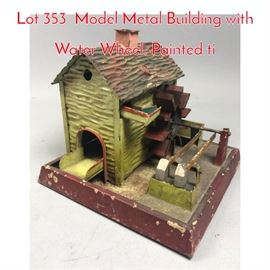 Lot 353 Model Metal Building with Water Wheel. Painted ti