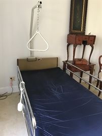 Hospital bed with lift strap