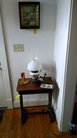 Primitive table, Bradley and Hubbard lamp, stereo viewer, brass candleholder.