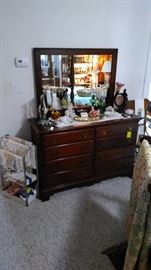 Mahogany dresser with mirror, linens, art deco dresser light, oil lamps, etc.