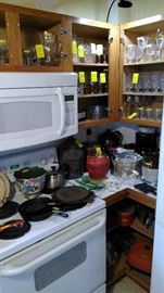 Salt gazed crocks with blue, Griswold skillets, crystal glassware, cookie jar, etc.