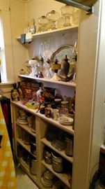 More oil lamps and kitchen and collectible items.