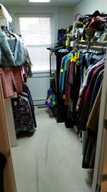 Lots of wonderful clothing and many, many purses, some shoes hidden underneath the clothes.