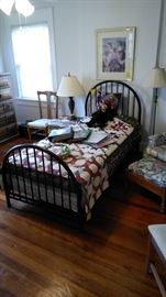 Vintage metal twin bed with binders of sports cards