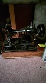 Vintage portable Singer sewing machine with case.