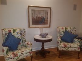 Queen Anne style wing back chairs, round accent table, framed print, crystal vase, & more.