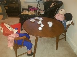 Child's wooden table and chairs. Raggedy Andy, adoption dolls, and more.