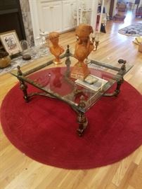 Heavy, square, beveled glass coffee table, Jaru sculptures, candelabra, round area rug, & more. 