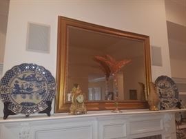 Large blue chargers, gold colored mantle clock, and more.