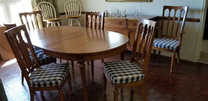 This dining table is gorgeous. It has been cover with a table pad always. Wonderful chairs 6 of them in all with 2 captain chairs.