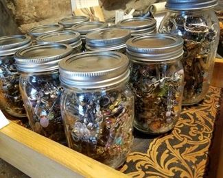 jars of loose, assorted jewelry pieces