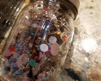 jars of loose, assorted jewelry pieces