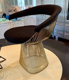 Close up of knock off Platner dining chairs