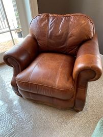 Leather club chair measures 42"W x 34"H x 38"D