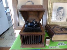 Antique Thomas Edison Amberola 30 in good working order. Come with a box of blue amberol record cylinders.