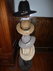 Cowboy hats and a hat rack.