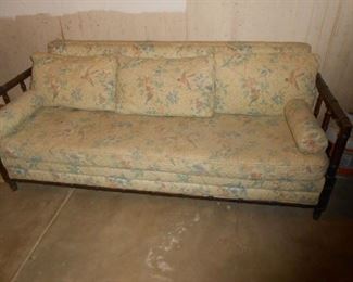 A solid wood sofa in the basement (walk out)