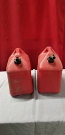 Two Red Plastic Gas Cans