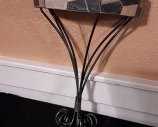 Tile and metal dish holder.