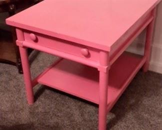 Pink painted end table with drawer.