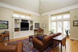 Immaculate leather furniture , antique tables and nice oriental rug.