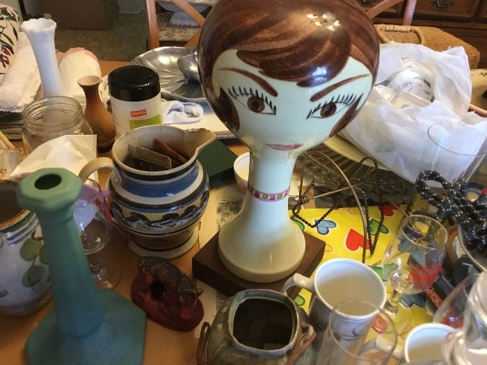 60-70’s wig/hat stand amid lots of collectibles. Wormwood pitcher. Van Briggle candlesticks
