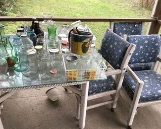 Patio table and chairs with jars