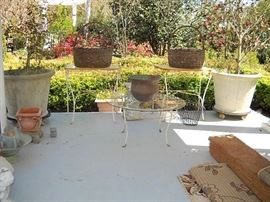 THIS IS THE OTHER 2 HUGE CONCRETE POTS AND THE 3 METAL GLASS TOP TABLES