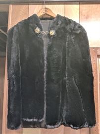 Woman's Vintage Seal Fur Cape with hand carved Art Deco clasp. $1,000
