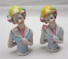 A pair of vintage porcelain half dolls