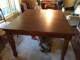 #1 tall table with 8 chairs and built in leaf 48-60x48x36 350.00
