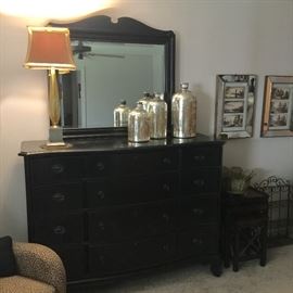 A.R.T. brand dark wood dresser with mirror. Matches King size bed and nightstands in the same brand. 