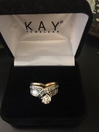 Diamond ring from Kay’s Jeweler: 
1/2 carat center diamond/ 5 mm round
14 k gold & silver 