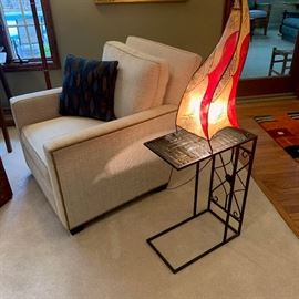 chair and pillow that matches sofa. Egyptian lamp and table