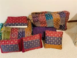 kingsized linens, sheets, bedskirt, shams with pillows, three decorative pillows and blanket