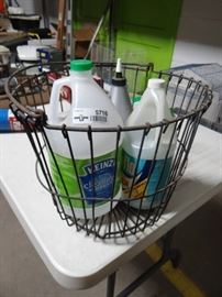 Metal basket w cleaning supplies.