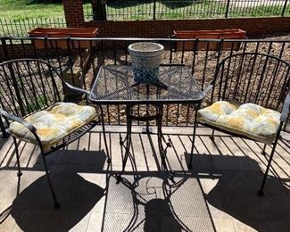 Wrought iron square table with 2 chairs. Love the chair backs.