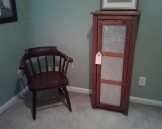 Pine cabinet with punched tin inserts and vintage arm chair