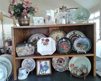 Some of the large collection of decorative plates