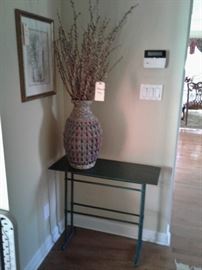 Small spool legged table and floral arrangement
