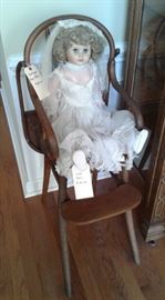 Antique high chair and old bride doll