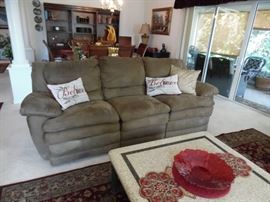 Micro fiber sofa with reclining ends. Mid brown color