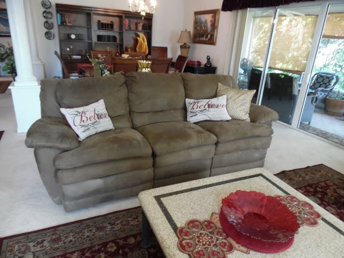 Micro fiber sofa with reclining ends.  Mid brown color