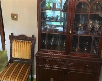 Nice medium sized china cabinet and chair! The cabinet is fill with quality stemware!