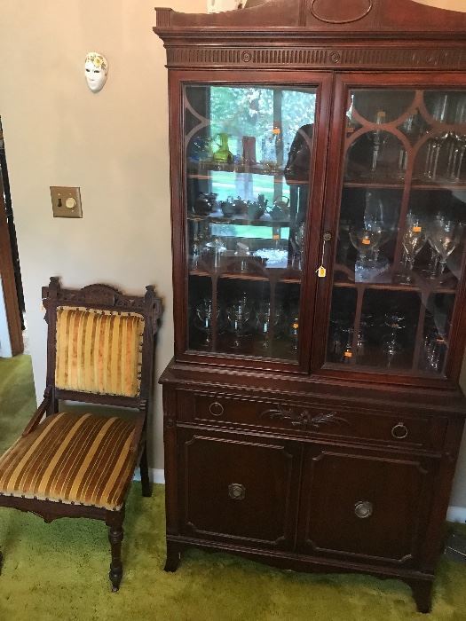 Nice medium sized china cabinet and chair! The cabinet is fill with quality stemware!