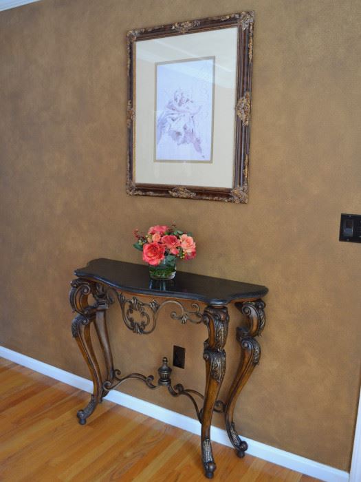 Console table and framed artwork