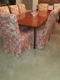 Gorgeous dining table with leaves and 10 upholstered chairs...very nice condition!