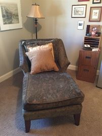 Comfortable chaise, floor lamp, file cabinet, artwork 